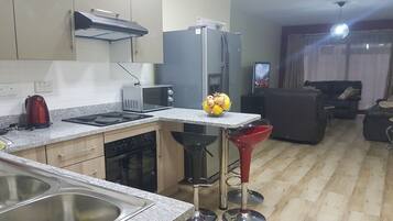 Comfort Apartment, 2 Bedrooms, Accessible, Garden View | Private kitchen | Full-sized fridge, microwave, oven, stovetop