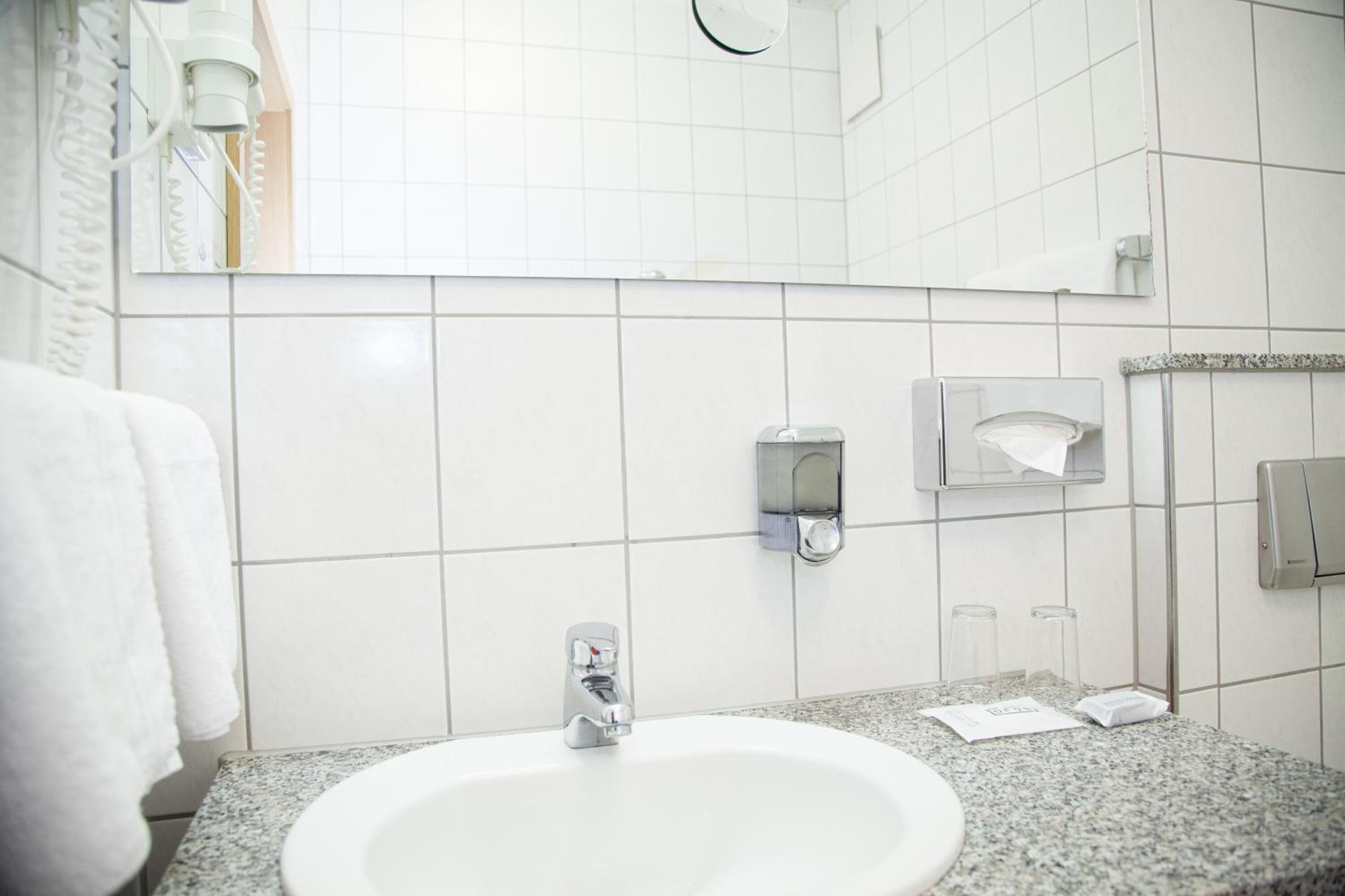 hair dryer, towels, soap, shampoo