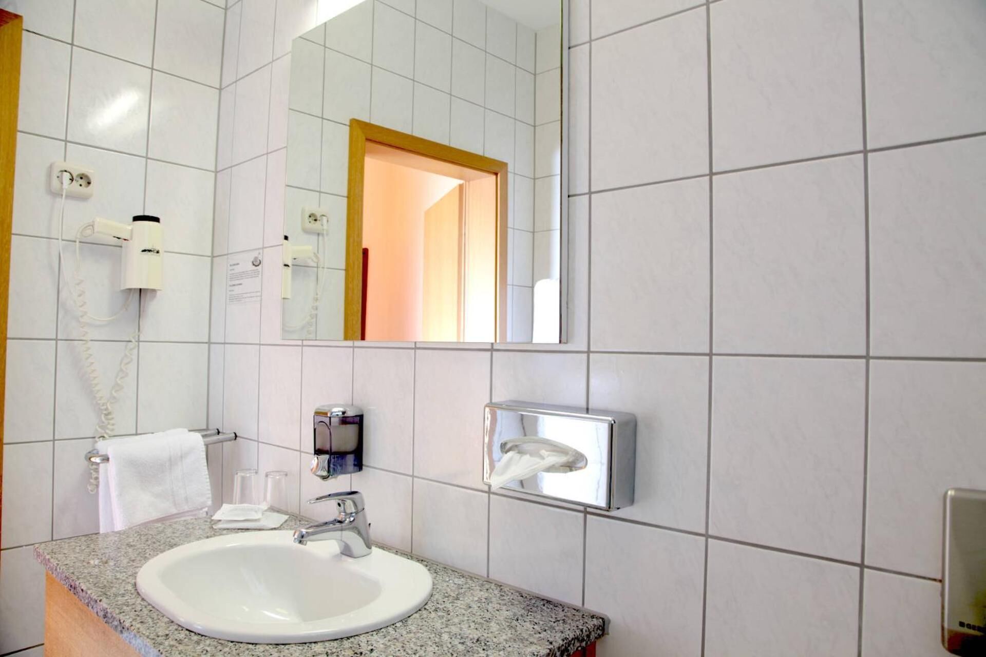 hair dryer, towels, soap, shampoo