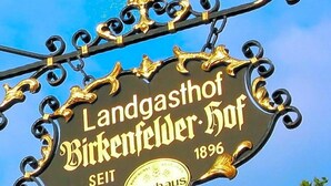 A sign for 'Landgasthof Birkenfelder Hof' with a date '1896' and the word 'SEIT' indicating the establishment year. - Birkenfelder Hof (Birkenfeld)