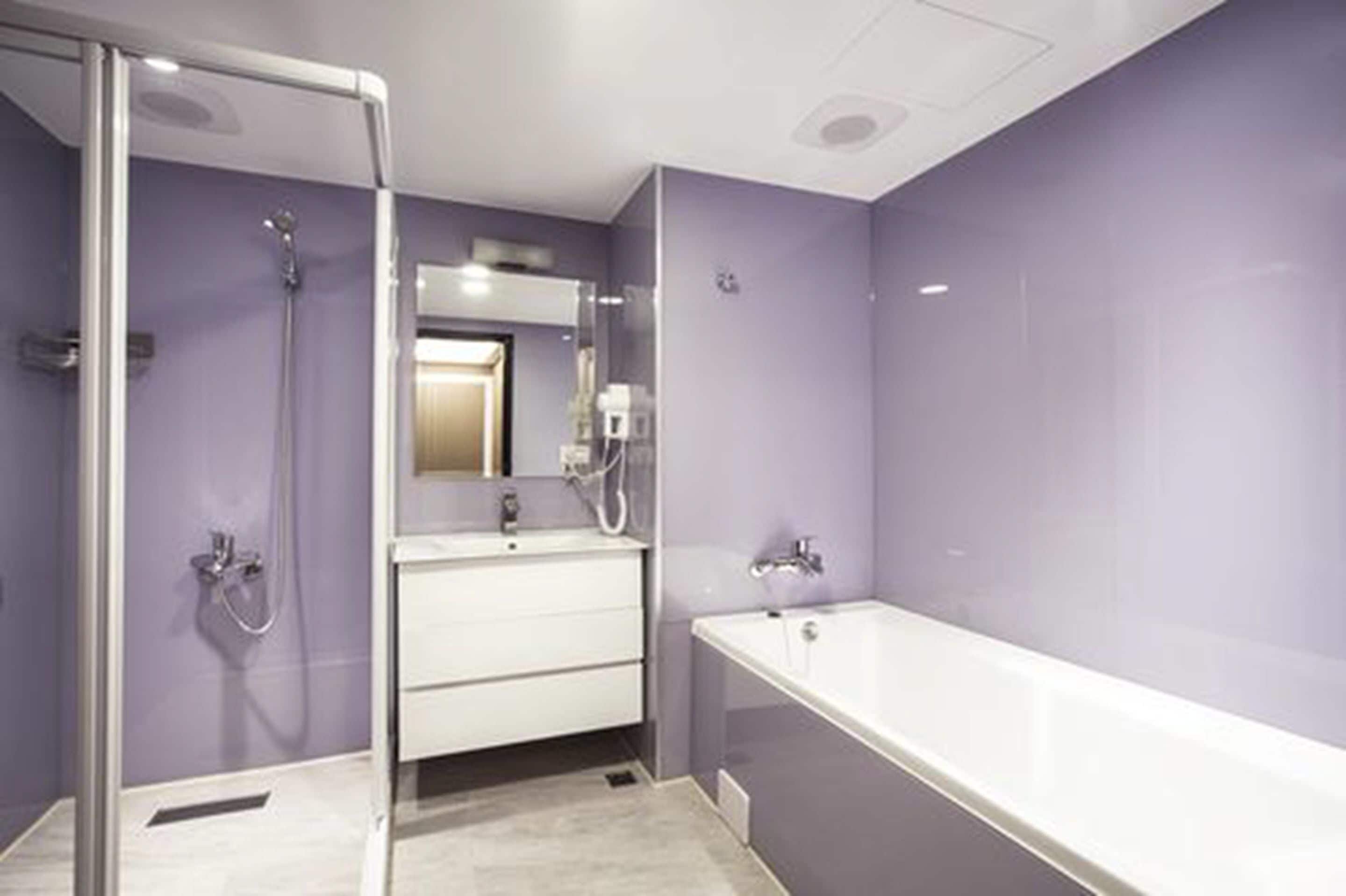 shower, hair dryer, slippers, towels