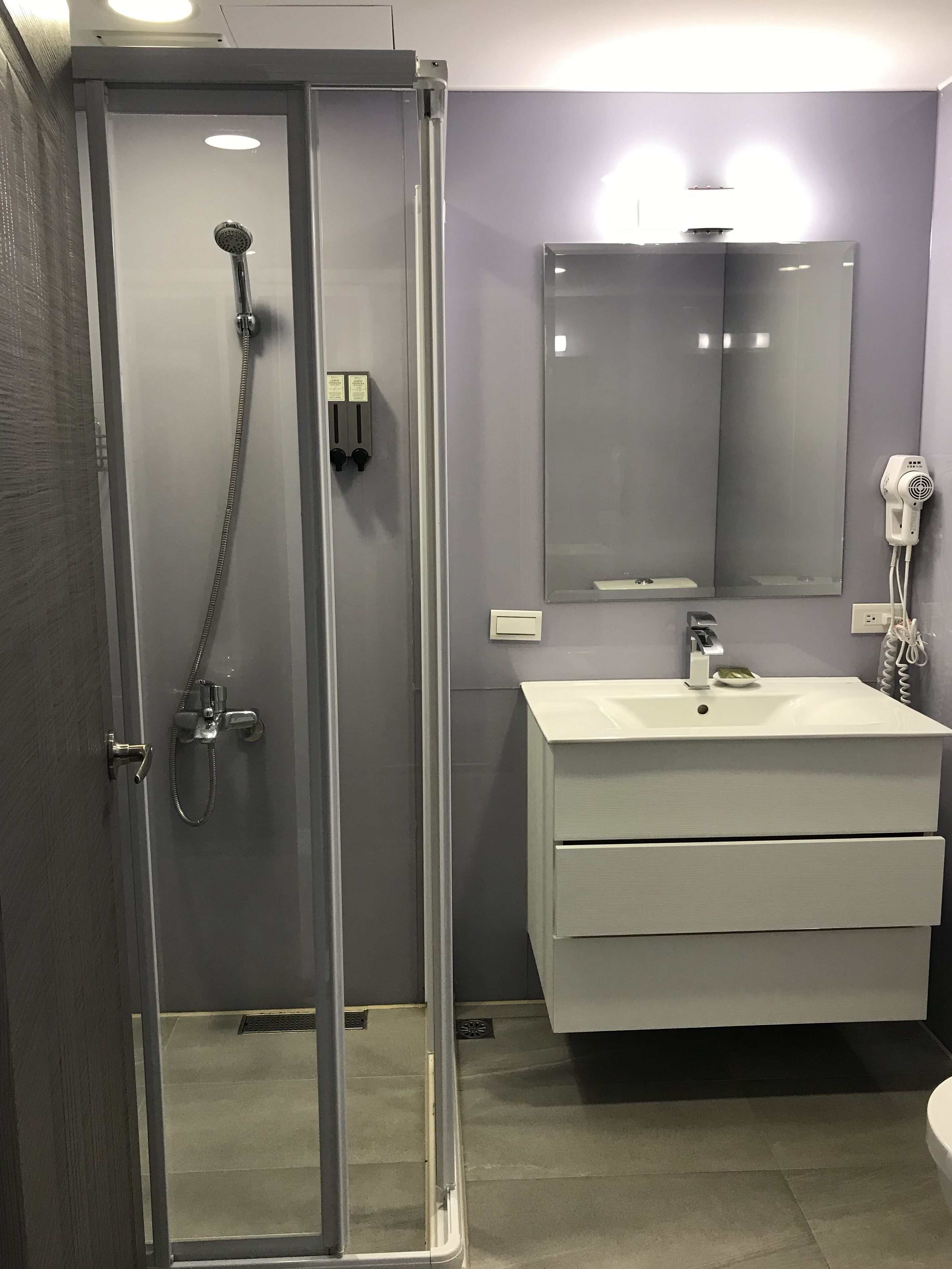 superior double room | bathroom | shower, hair dryer, slippers, towels