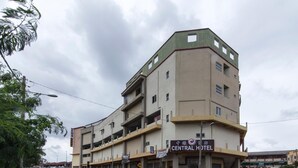 A multi-story building with a sign reading "CENTRAL HOTEL".