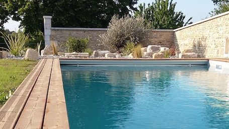 Seasonal outdoor pool, open 11:00 AM to 8:00 PM, pool umbrellas