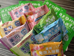 A collection of colorful bath products with Japanese text.
