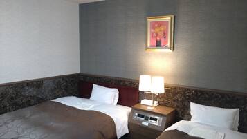 A hotel room with two beds, a nightstand with a lamp, a painting on the wall, and a marble-patterned headboard.