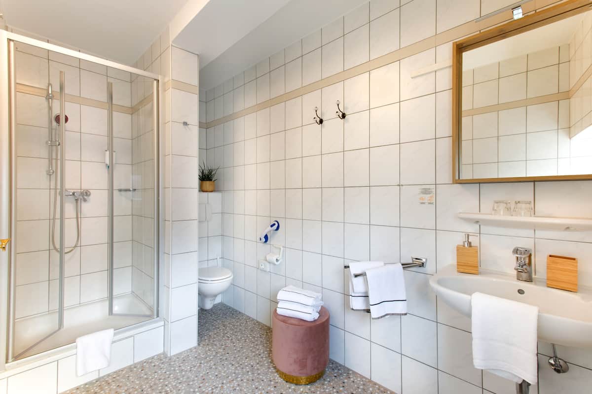 shower, eco-friendly toiletries, hair dryer, towels