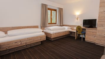 Quadruple Room | Living area | Flat-screen TV