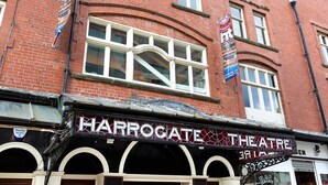 A theater with a marquee reading "HARROGATE THEATRE" and a sign for "Mayfair Security". - Granville Apartments (Harrogate)