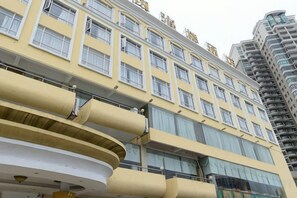 A multi-story hotel with balconies and large windows. - Wanghailou Hotel (Huizhou)