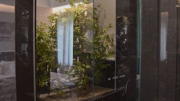 Suite Platinum | Bathroom | Deep soaking tub, rainfall showerhead, hair dryer, bathrobes