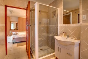 Separate bathtub and shower, towels