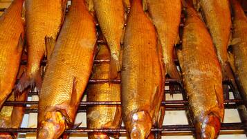 Several fish on a grill.