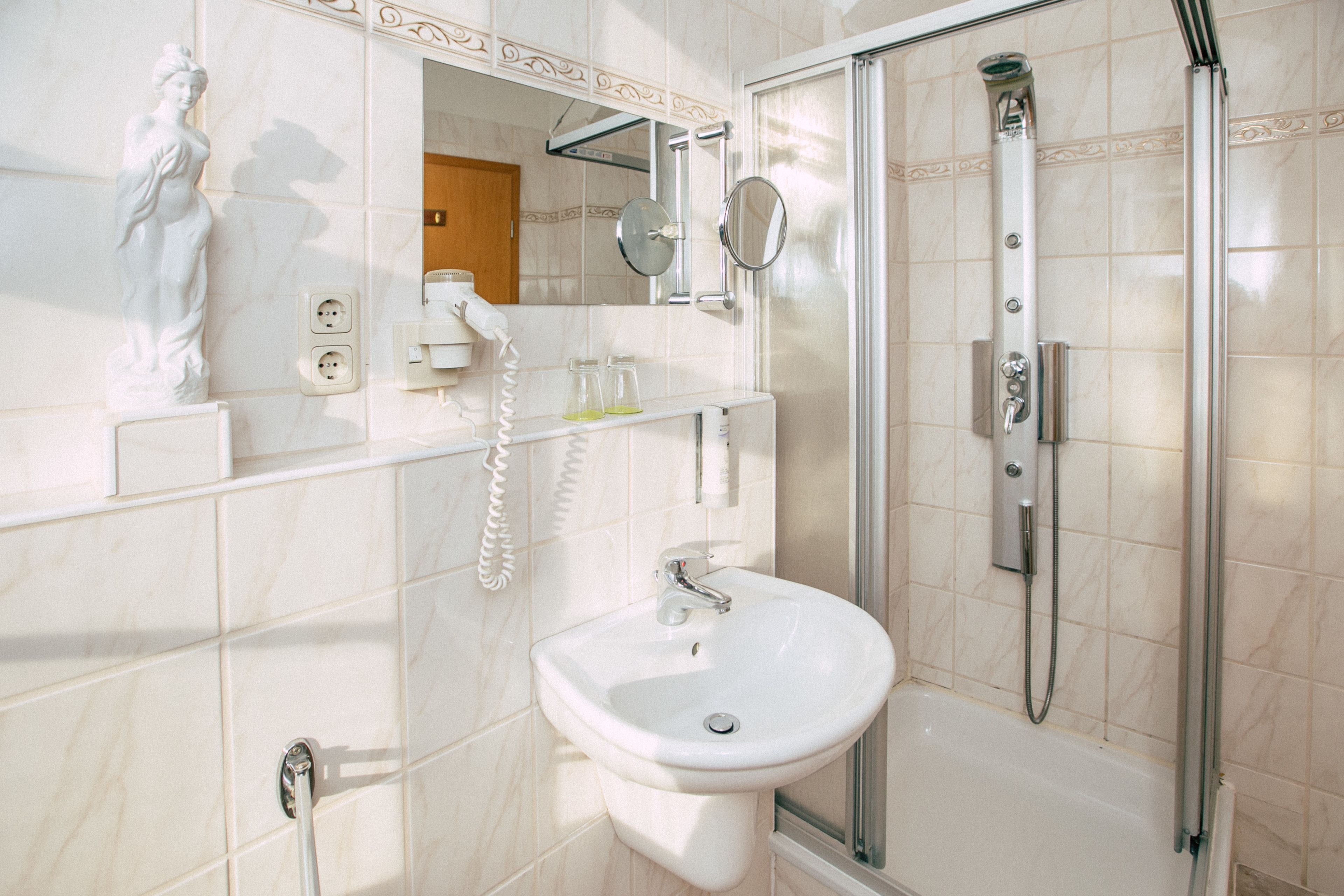 single room | bathroom | deep-soaking bathtub, rainfall showerhead, free toiletries, hair dryer