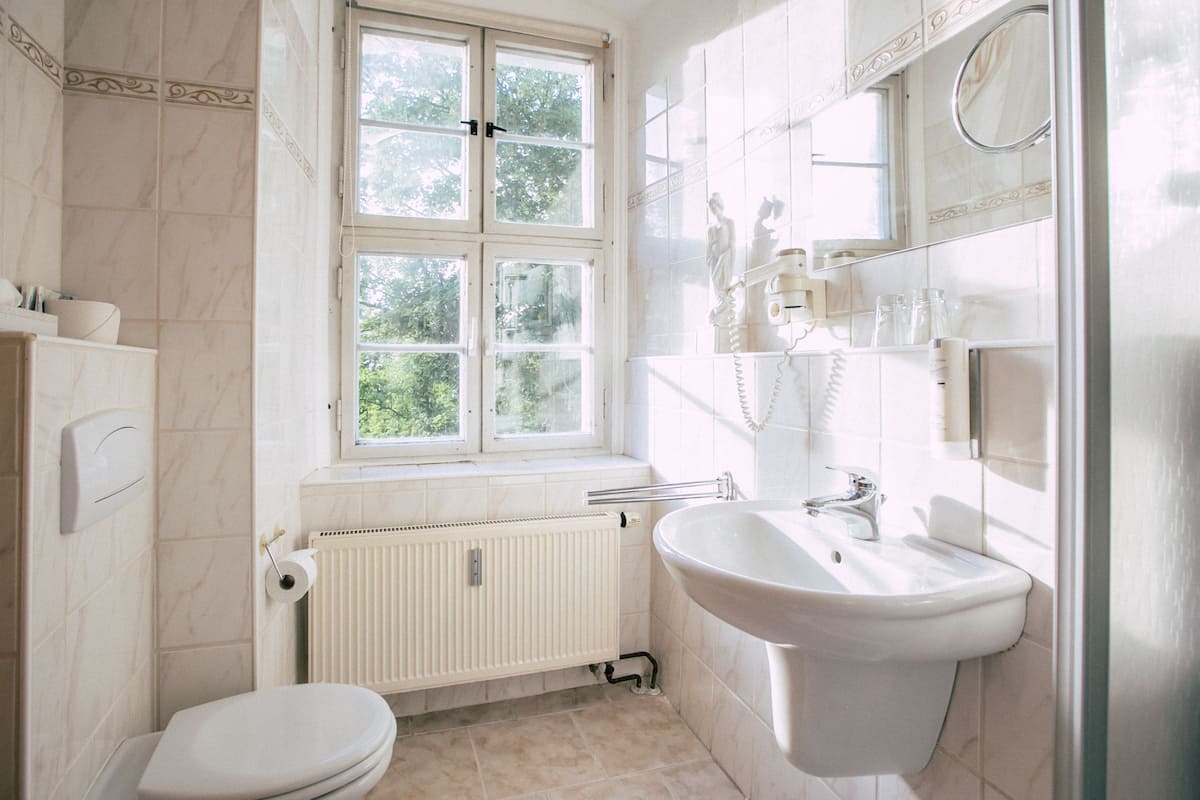 deep-soaking bathtub, rainfall showerhead, free toiletries, hair dryer