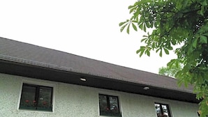 A building with a sign that reads 'LANDIYYL - HOTEL GRÜNES TÜR IM WEINZIERLGUT.'
