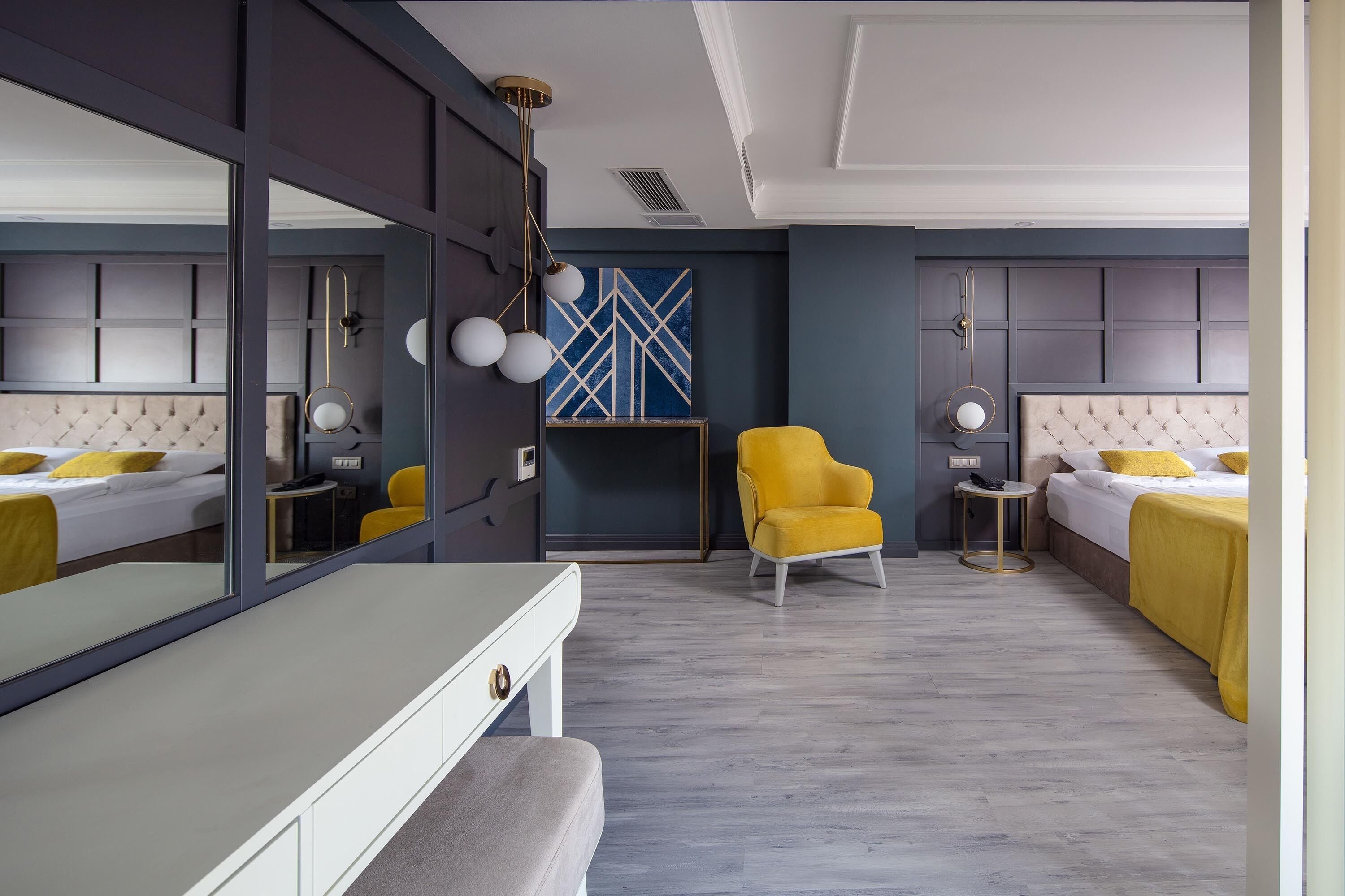 family room | 1 bedroom, minibar, in-room safe, desk