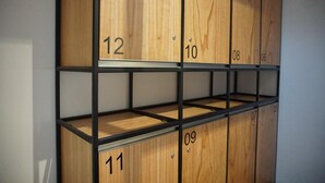 A set of wooden lockers with numbers 10, 11, 12, 08, 06, 09, and 07. - Lantai Dua Jogja - Hostel (Depok)