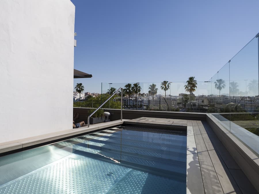 Outdoor pool, open 11:30 AM to 8:00 PM, pool loungers