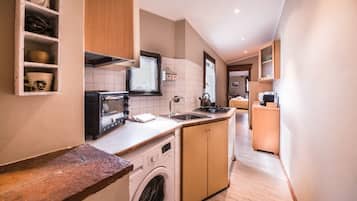 Apartment, 2 Bedrooms | Private kitchenette | Full-size fridge, stovetop, cookware/dishes/utensils