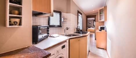 Apartment, 2 Bedrooms | Private kitchenette | Full-size fridge, stovetop, cookware/dishes/utensils