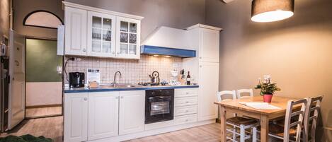 Apartment, 2 Bedrooms | Private kitchen | Full-sized fridge, stovetop, cookware/dishes/utensils