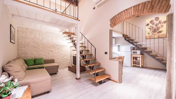 Apartamento, 2 quartos | Área de estar