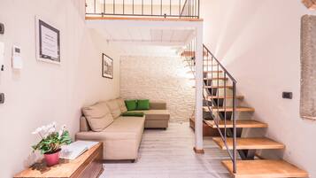 Apartamento, 2 quartos | Área de estar