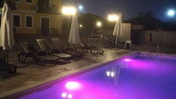 Seasonal outdoor pool, open 8:30 AM to 6:00 PM, pool umbrellas