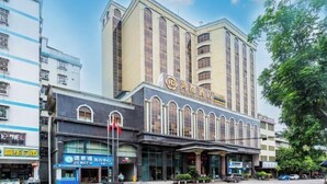 A hotel with a prominent entrance, multiple floors, and a large sign with Chinese characters. - Hongdu Hotel (Xingning)