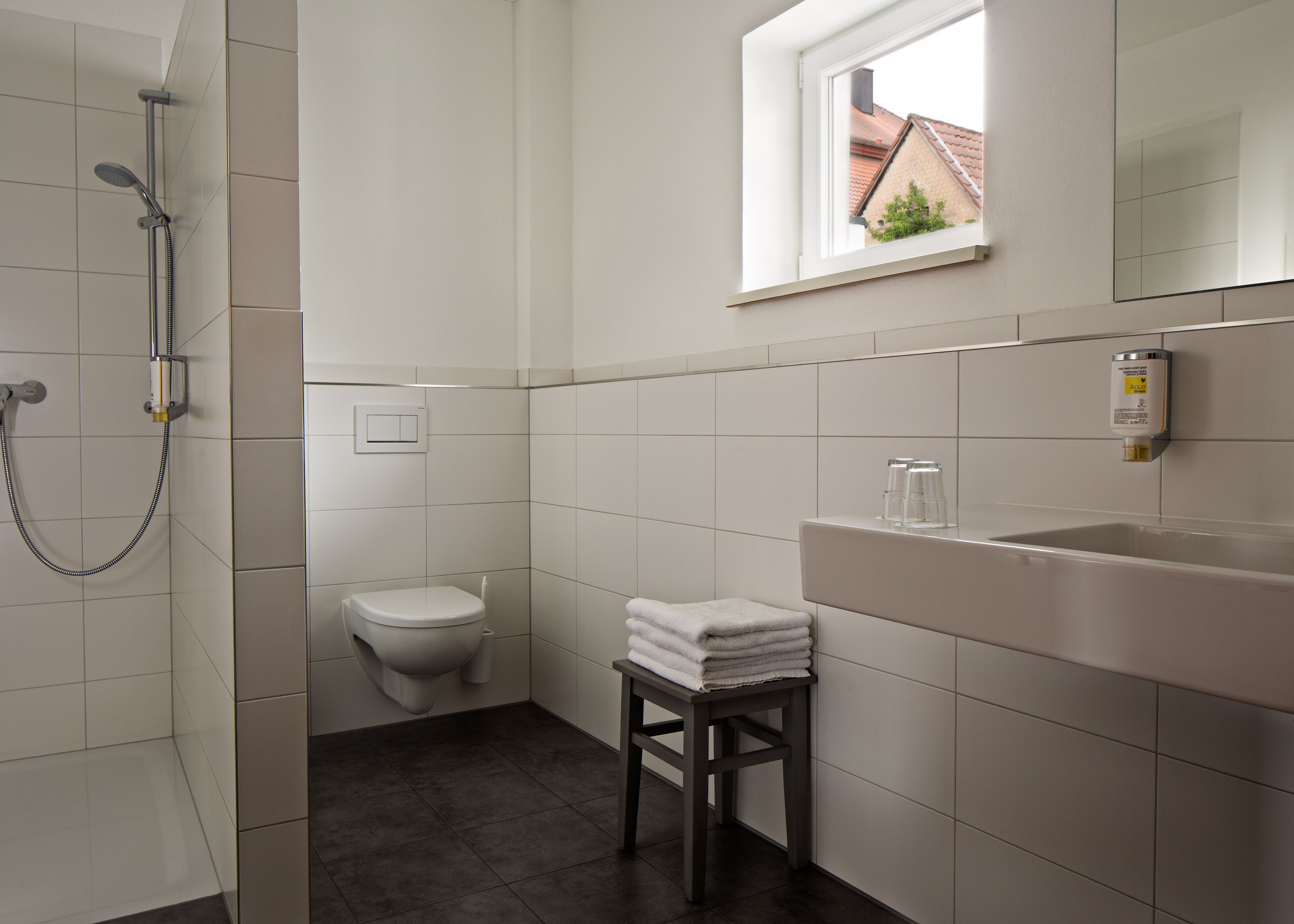 quadruple room | bathroom | shower, hair dryer, towels, soap