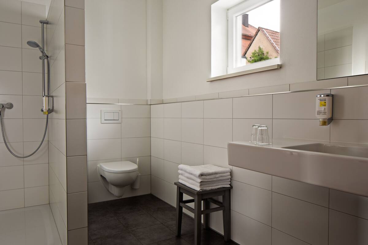 quadruple room | bathroom | shower, hair dryer, towels, soap