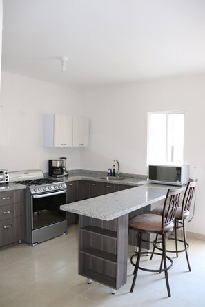 Family House, Multiple Beds, Non Smoking, Pool Access | Private kitchen | Full-size fridge, microwave, oven, stovetop