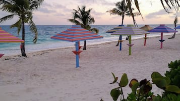 On the beach, white sand, free beach cabanas, sun-loungers