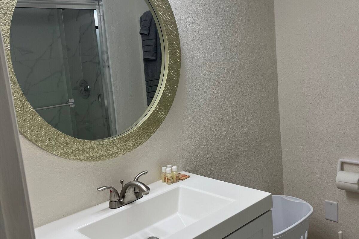 signature studio suite, 1 queen bed | bathroom | shower, free toiletries, towels