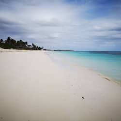 On the beach, white sand, free beach cabanas, sun loungers