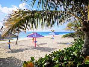 On the beach, white sand, free beach cabanas, sun loungers