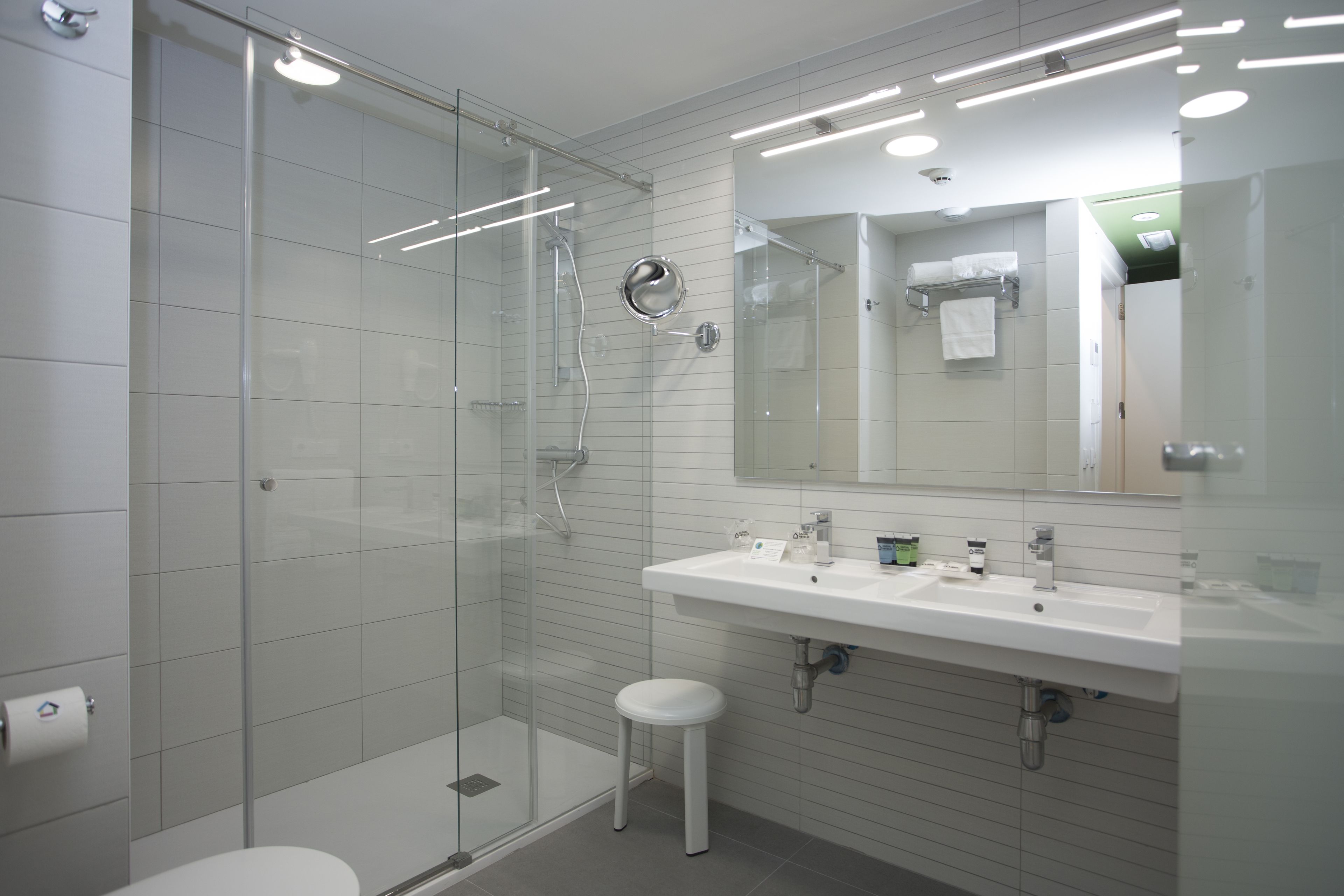 shower, designer toiletries, hair dryer, towels