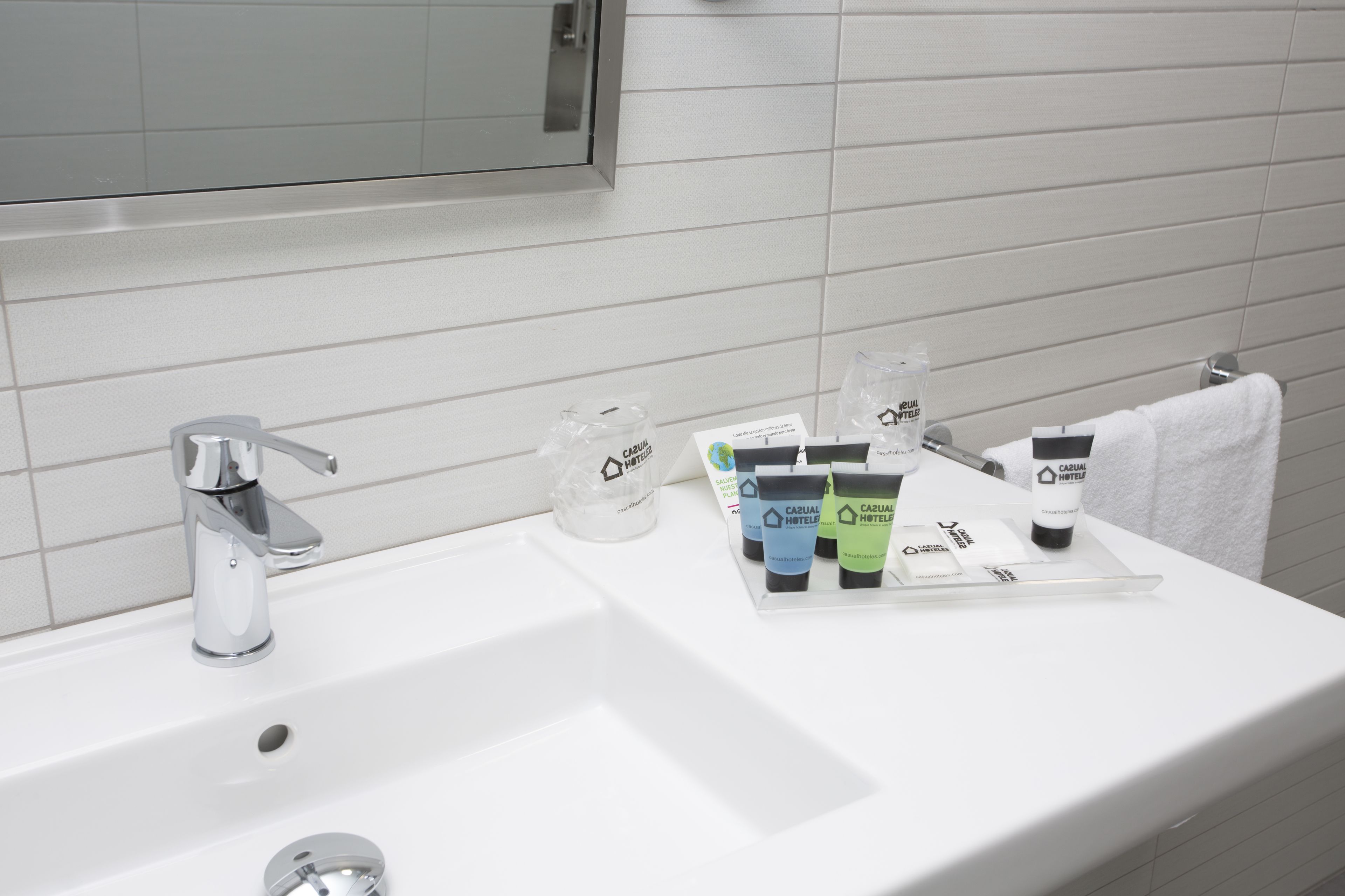 shower, designer toiletries, hair dryer, towels