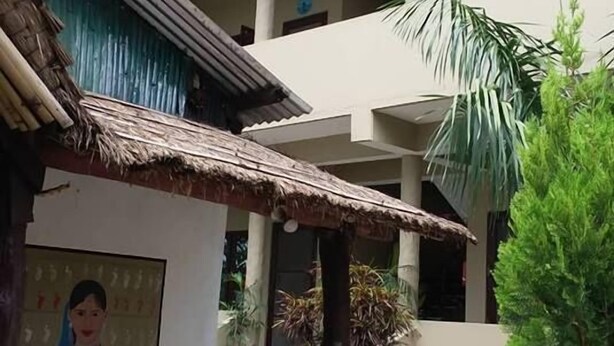 A multi-story building with a central courtyard. - Sauraha Boutique Resort (Sauraha)