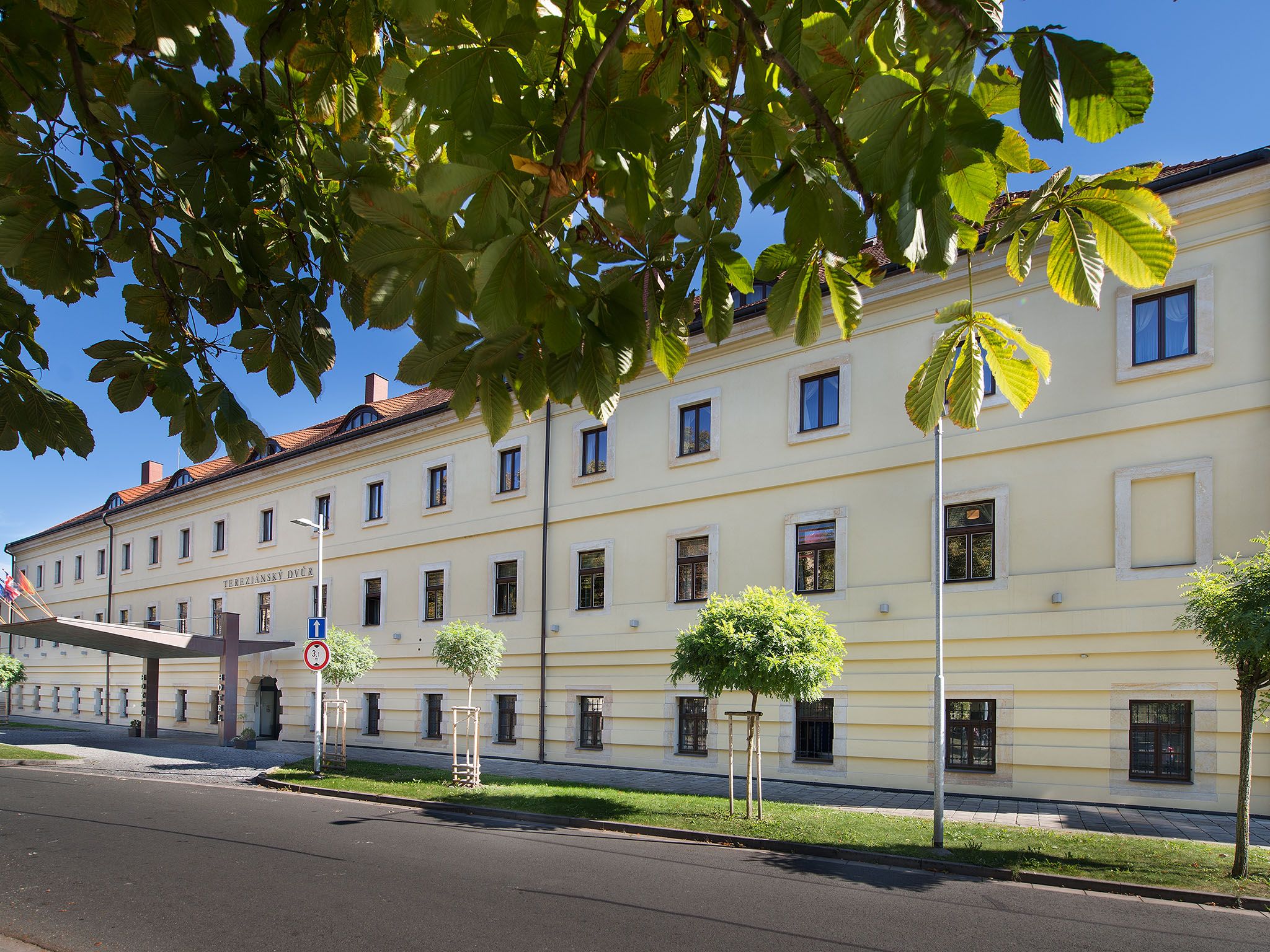 A multi-story building with a classic architectural style, featuring a symmetrical facade with evenly spaced windows and a central entrance.
