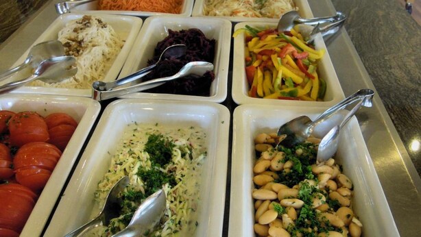 A buffet with various dishes including pasta, beans, and vegetables. - Tagungshaus Regina Pacis (Leutkirch im Allgau)