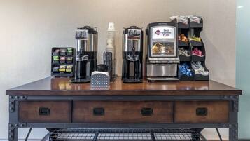 A coffee station with multiple coffee machines, a coffee grinder, and a coffee pod dispenser.