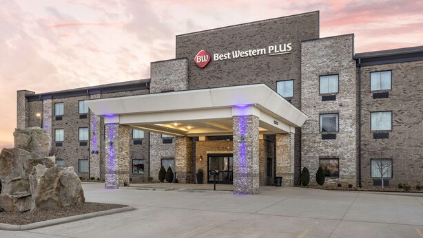 A hotel with a modern brick facade, a covered entrance, and a sign reading "Best Western PLUS". - Best Western Plus Owensboro (Owensboro)