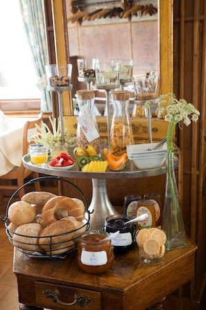 A breakfast buffet with various food items and condiments. - Brutsches Rebstock (Laufenburg)