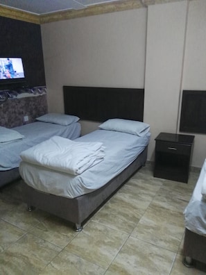 Triple Room, Private Bathroom | Desk, bed sheets