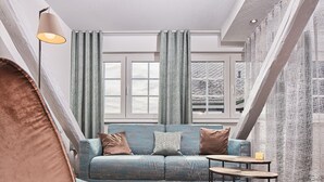 Quarto superior | Área de estar