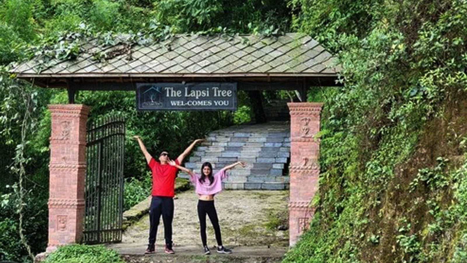 A covered entrance with a sign reading "The Lapsi Tree Welcomes You."