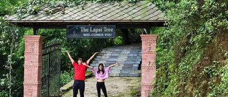 A covered entrance with a sign reading "The Lapsi Tree Welcomes You."