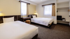 A hotel room with two beds, a desk, a chair, a TV, and a shelf with a coffee maker. - KOKO HOTEL Akabane Station (Tokyo)